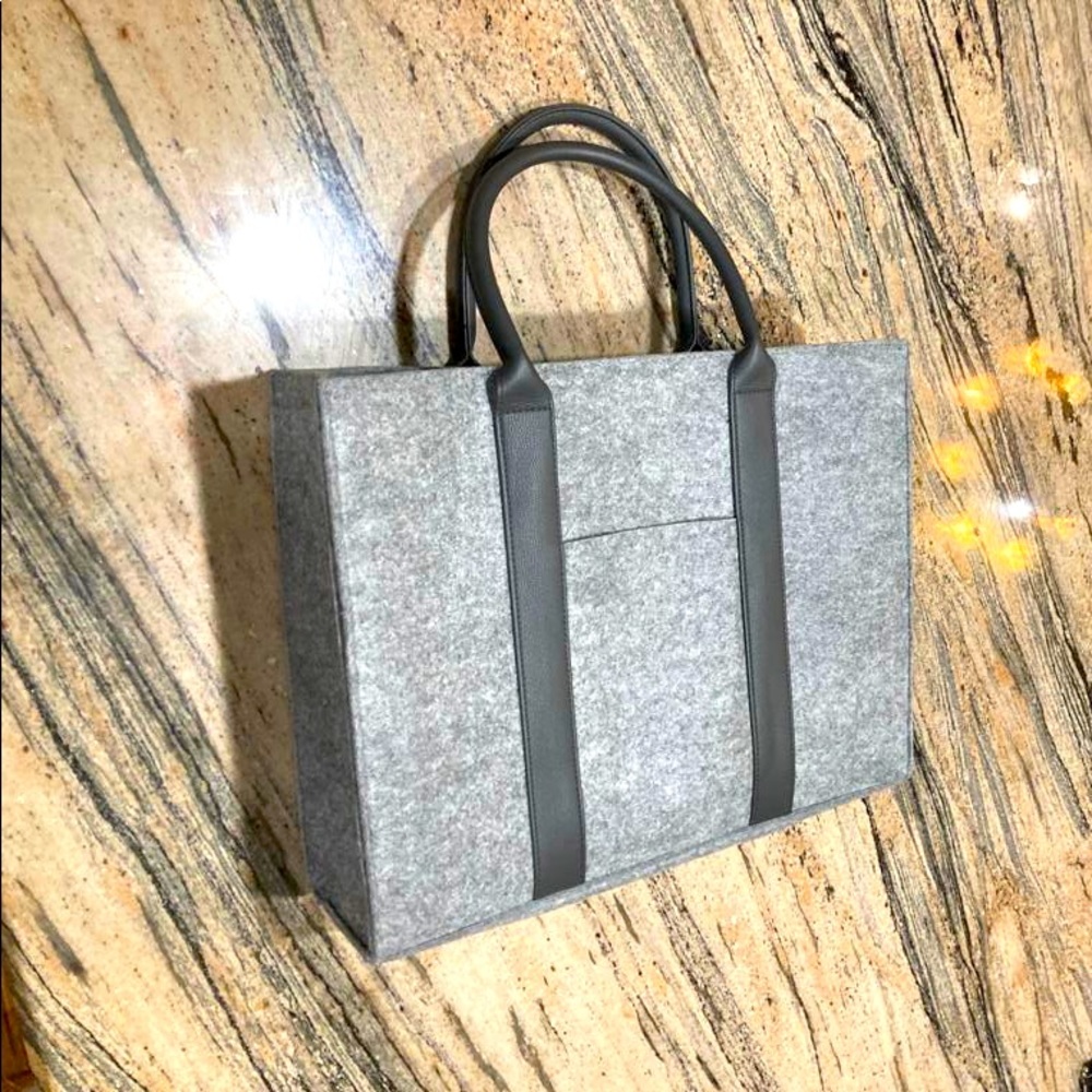 New grey structured tote bag by La Prairie felt like man made material